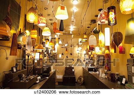 Large group of lighting fixtures on display in store View Large Photo Image Stock Photograph - Large group of lighting fixtures on display in store. Fotosearch