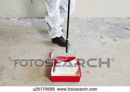 Low section of female worker with paint roller and tray View Large Photo Image Stock Photo - Low section of female worker with paint roller and tray. Fotosearch