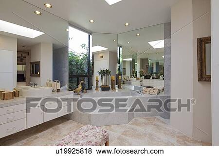 Stock Photo - Luxurious bathroom with bathtub in mansion. Fotosearch