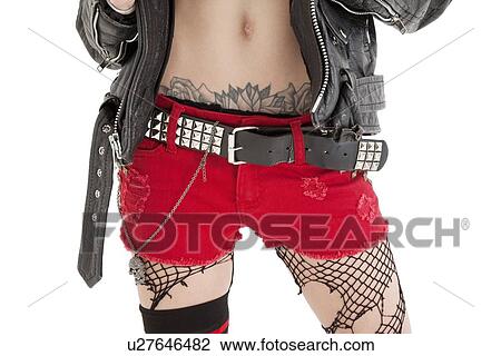 Midsection of woman with tattoo wearing shorts over white background View Large Photo Image Stock Image - Midsection of woman with tattoo wearing shorts over white background. Fotosearch