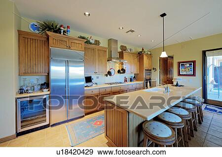 Stock Photo - Modern kitchen interior of mansion. Fotosearch