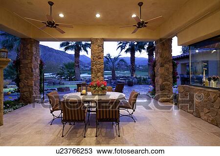 Stock Image - Outdoor view of mountain from patio in luxury villa. Fotosearch