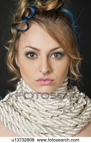 Portrait of beautiful blond female with rope around neck View Large Photo Image Stock Photo - Portrait of beautiful blond female with rope around neck. Fotosearch
