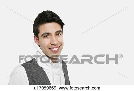 Portrait of handsome young man over colored background View Large Photo Image Stock Photo - Portrait of handsome young man over colored background. Fotosearch
