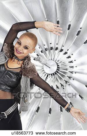 Portrait of happy African American woman posing in front of reflector umbrella View Large Photo Image Stock Image - Portrait of happy African American woman posing in front of reflector umbrella. Fotosearch