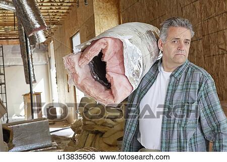 Portrait of mature man carrying load over shoulder View Large Photo Image Stock Photograph - Portrait of mature man carrying load over shoulder. Fotosearch
