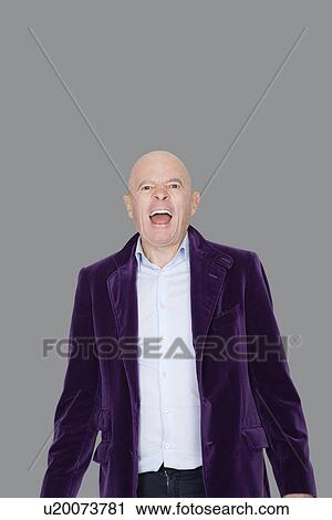 Portrait of screaming senior man over gray background View Large Photo Image Stock Image - Portrait of screaming senior man over gray background. Fotosearch