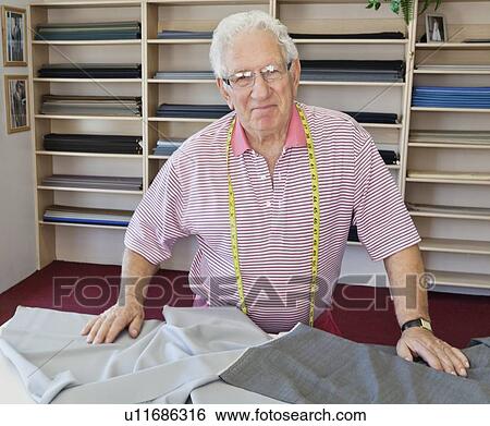 Portrait of smiling senior tailor in shop View Large Photo Image Stock Photograph - Portrait of smiling senior tailor in shop. Fotosearch