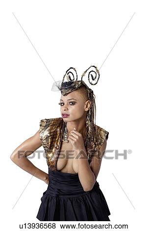 Stock Photo - Portrait of young African American woman with fashionable headdress over white background. Fotosearch