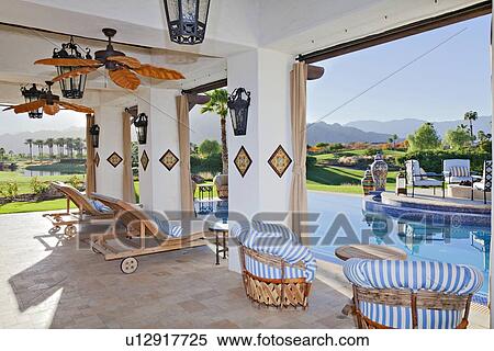 Seating furniture in patio of modern mansion View Large Photo Image Stock Photography - Seating furniture in patio of modern mansion. Fotosearch