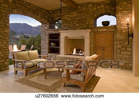 Seating furniture with fireplace in patio of mansion View Large Photo Image Stock Photograph - Seating furniture with fireplace in patio of mansion. Fotosearch