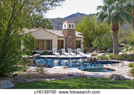 Sun loungers at poolside in luxury mansion View Large Photo Image Stock Image - Sun loungers at poolside in luxury mansion. Fotosearch