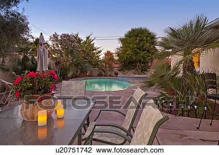Table and chair at poolside in luxury villa View Large Photo Image Stock Image - Table and chair at poolside in luxury villa. Fotosearch