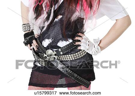 Stock Photo - Torso of a woman wearing skull and crossbones with hands on hips. Fotosearch