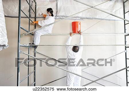 Two manual painters working in commercial space View Large Photo Image Stock Photography - Two manual painters working in commercial space. Fotosearch