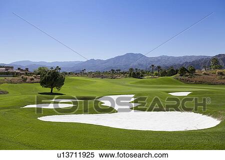View of golf course with sand traps View Large Photo Image Stock Photography - View of golf course with sand traps. Fotosearch