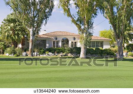 View of lawn with luxury manor house in background View Large Photo Image Stock Image - View of lawn with luxury manor house in background. Fotosearch