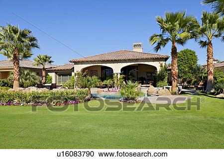 View of luxury manor house with lawn in foreground View Large Photo Image Stock Image - View of luxury manor house with lawn in foreground. Fotosearch