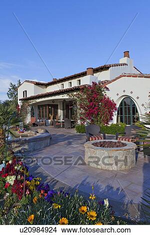 Picture - View of luxury manor house with patio. Fotosearch