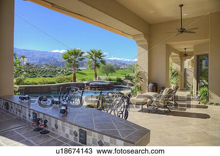 Stock Image - View of modern mansion patio. Fotosearch