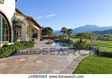 Picture - View of mountains and swimming pool from luxury manor house. Fotosearch