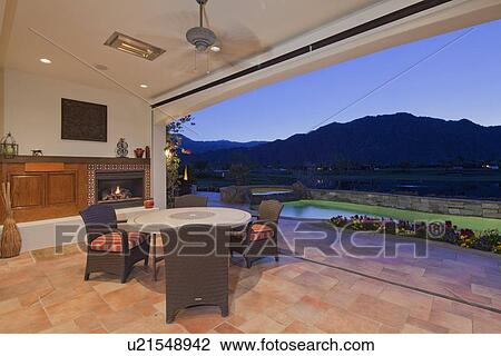 View of mountains and swimming pool from patio of luxury manor house View Large Photo Image Stock Image - View of mountains and swimming pool from patio of luxury manor house. Fotosearch