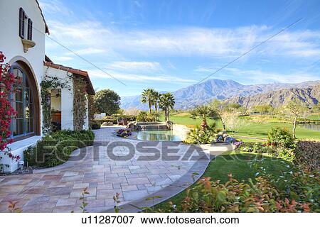 Stock Photo - View of mountains from luxury manor house. Fotosearch