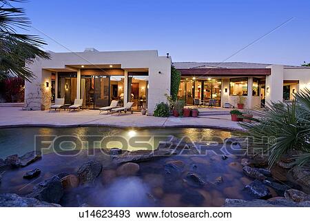 Stock Image - View of swimming pool in luxury villa. Fotosearch