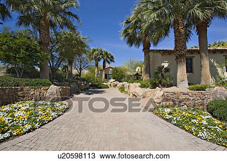 Stock Image - Walkway leading to residential house. Fotosearch