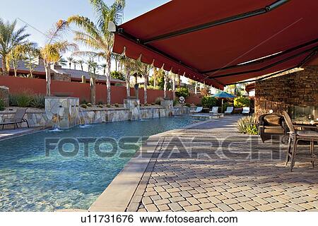 Window shade in patio near pool of luxury mansion View Large Photo Image Stock Photograph - Window shade in patio near pool of luxury mansion. Fotosearch
