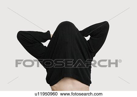 Young man wearing t-shirt over colored background View Large Photo Image Stock Image - Young man wearing t-shirt over colored background. Fotosearch