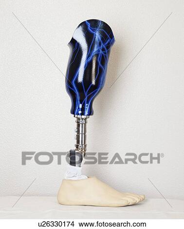 Picture - An advanced prosthetic foot over gray wall. Fotosearch
