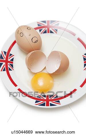 Anthropomorphic brown egg with egg shells and yoke in plate View Large Photo Image Stock Photo - Anthropomorphic brown egg with egg shells and yoke in plate. Fotosearch
