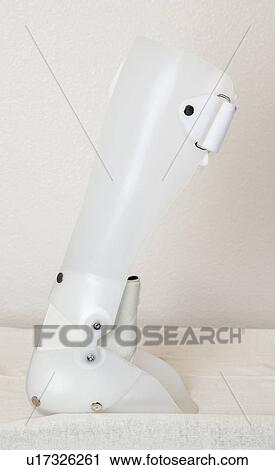 Stock Image - Artificial limb over gray background. Fotosearch