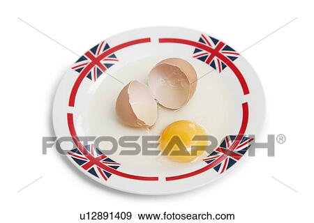 Broken brown egg on plate over white background View Large Photo Image Stock Photo - Broken brown egg on plate over white background. Fotosearch