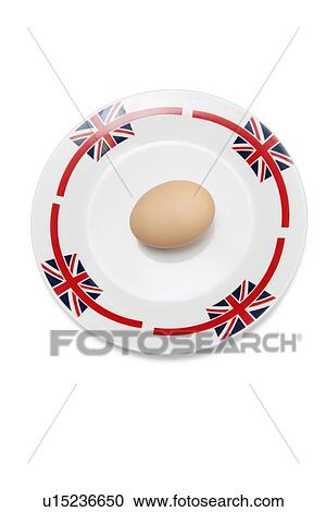 Brown egg in plate against white background View Large Photo Image Stock Image - Brown egg in plate against white background. Fotosearch