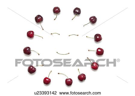 Cherries surrounding smiley face made by stems on white background View Large Photo Image Stock Image - Cherries surrounding smiley face made by stems on white background. Fotosearch