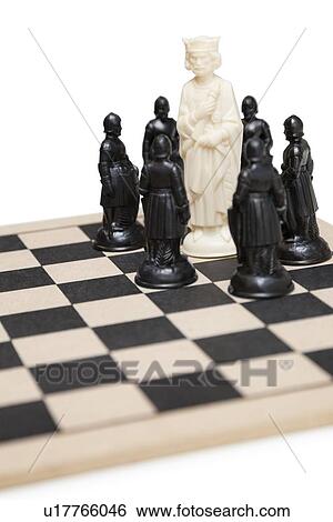 Chess game with king surrounded by black pawns View Large Photo Image Stock Photograph - Chess game with king surrounded by black pawns. Fotosearch