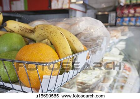 Close-up of fruits in basket on display counter View Large Photo Image Stock Photography - Close-up of fruits in basket on display counter. Fotosearch