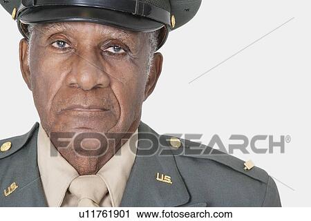 Stock Image - Close-up portrait of a senior male US military officer over gray background. Fotosearch