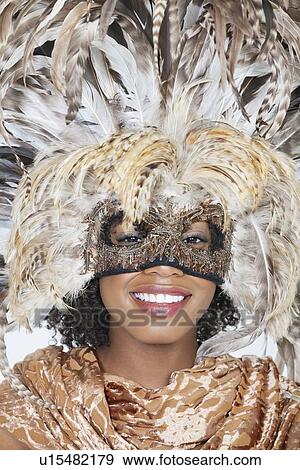 Stock Photo - Close-up portrait of an African American woman in a traditional wear. Fotosearch