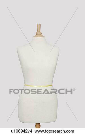 Picture - Dressmaker's model against gray background. Fotosearch