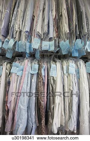 Dry cleaned clothes at launderette View Large Photo Image Stock Image - Dry cleaned clothes at launderette. Fotosearch