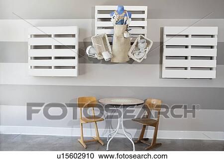 Stock Image - Empty kid's table and chair at cafe. Fotosearch