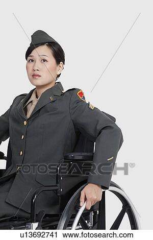 Female US military officer in wheelchair over gray backgrounds View Large Photo Image Stock Image - Female US military officer in wheelchair over gray backgrounds. Fotosearch