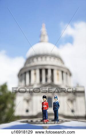 Figurines of London officers with St. Paul's Cathedral in background View Large Photo Image Stock Photo - Figurines of London officers with St. Paul's Cathedral in background. Fotosearch
