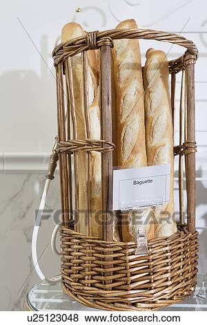 Stock Photo - Fresh baguettes in basket. Fotosearch
