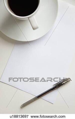 High angle view of coffee cup with pen on a blank paper View Large Photo Image Stock Photo - High angle view of coffee cup with pen on a blank paper. Fotosearch