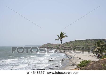 Stock Photo - High angle view of Vagator beach, Goa, India. Fotosearch
