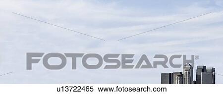 High section of office buildings against cloudy sky, London, England, UK View Large Photo Image Stock Photography - High section of office buildings against cloudy sky, London, England, UK. Fotosearch